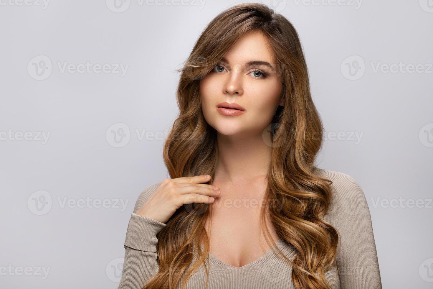 Portrait of young pretty woman with a curly hairstyle photo