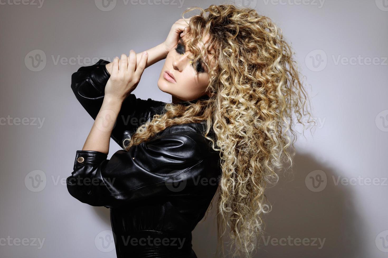 Sexy woman with a stylish Afro hairstyle and professional make-up photo