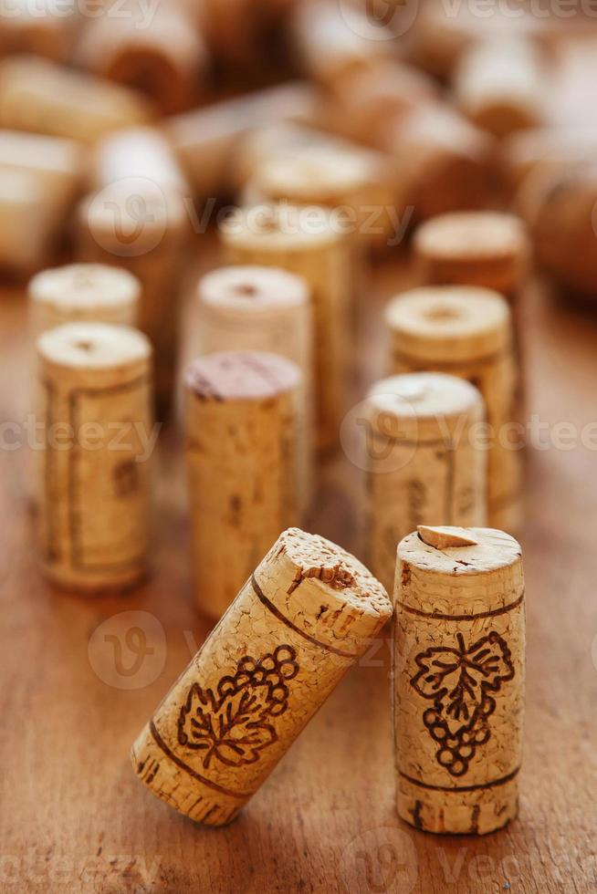 Wine corks on wooden table photo