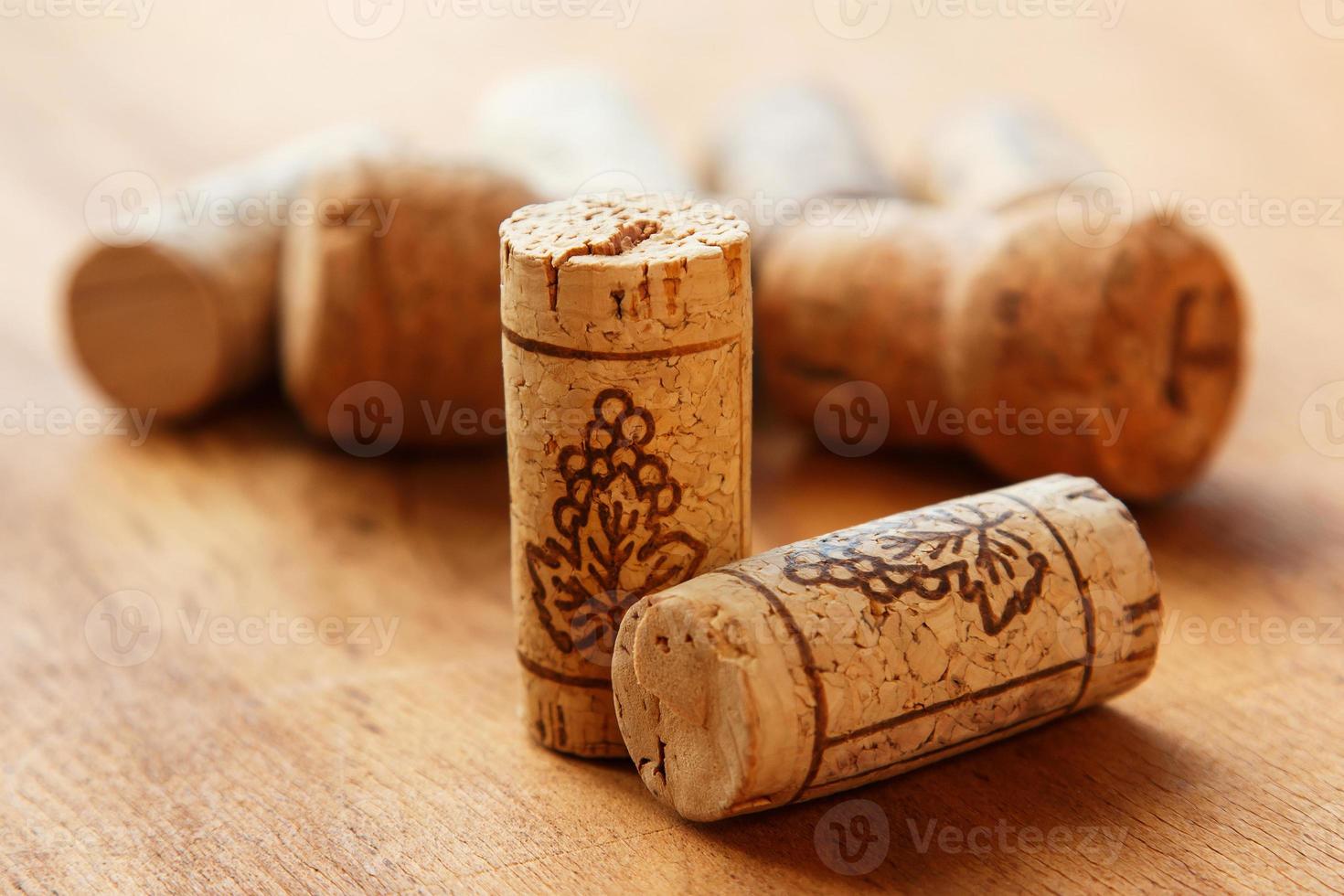 Wine corks on wooden table photo