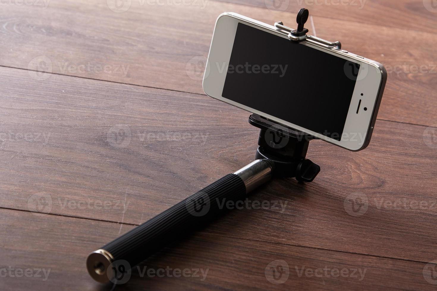 Smart phone and selfie stick photo