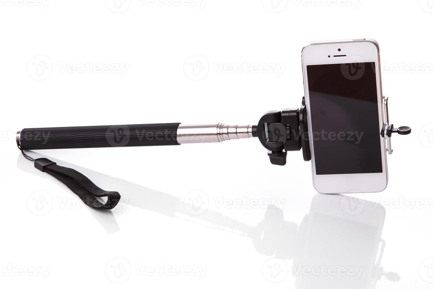 Smart phone on a selfie stick photo