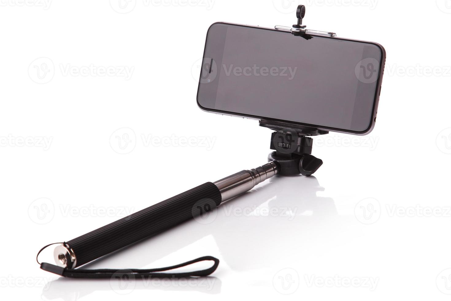 Smart phone on a selfie stick photo