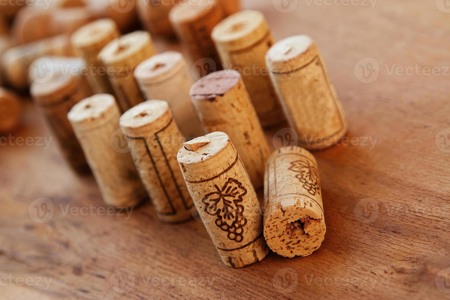 Wine corks on wooden table photo