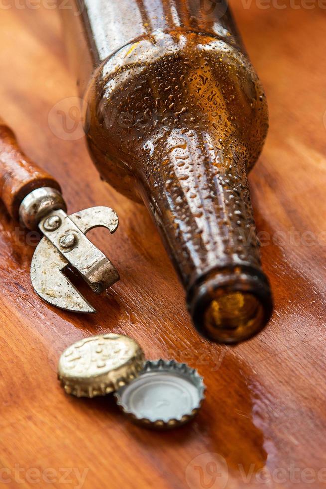 Vintage opener and beer photo