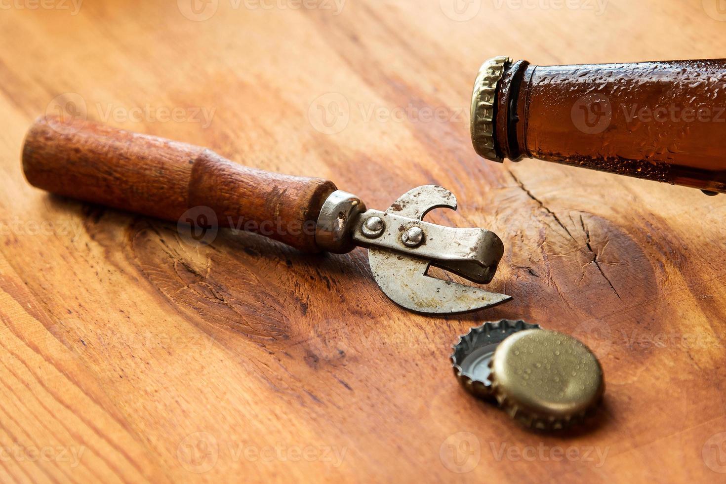 Vintage opener and beer photo