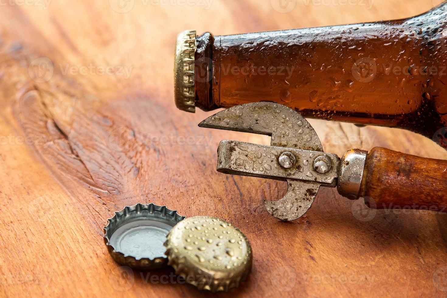 Vintage opener and beer photo