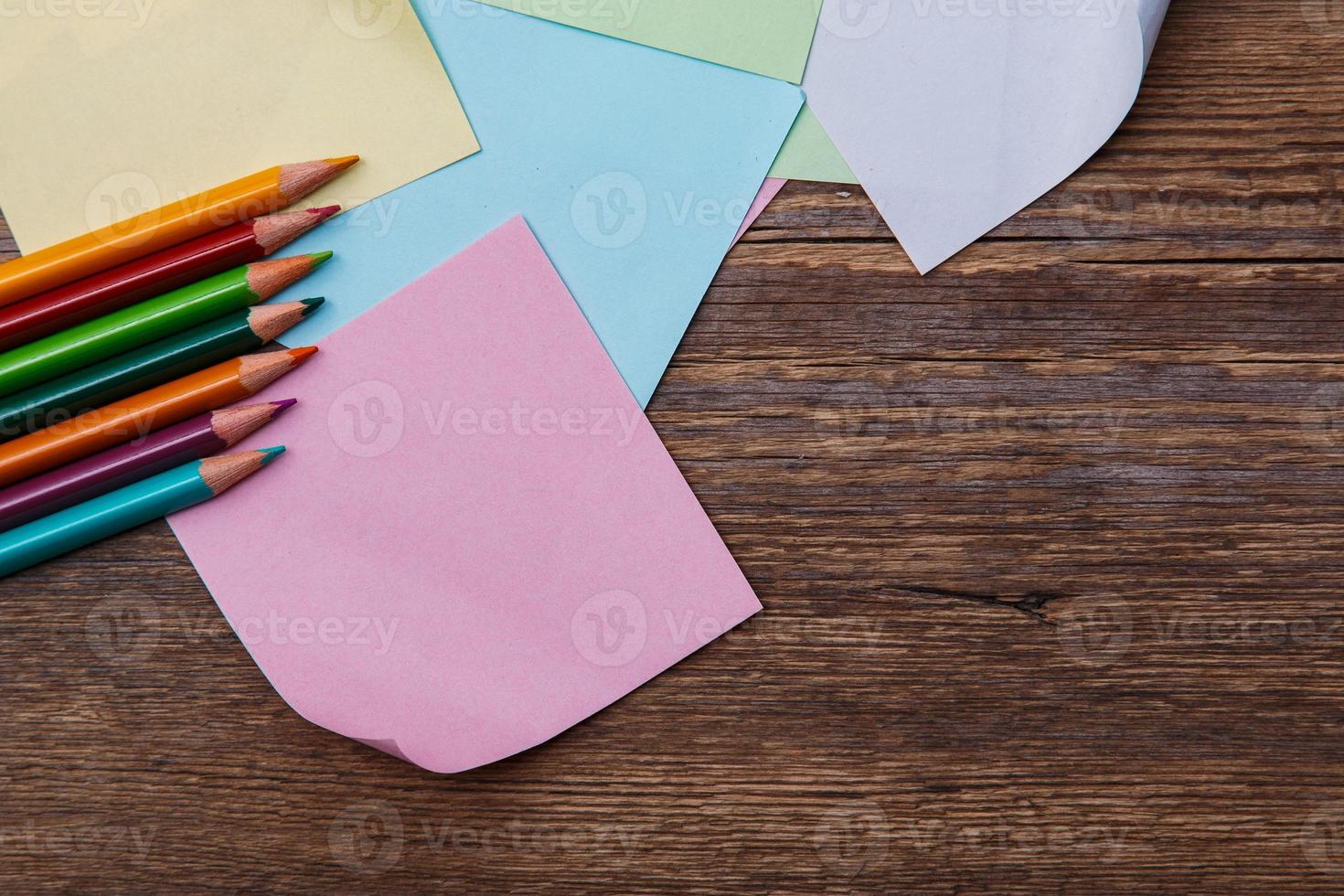 Colorful pencils and memo stickers photo