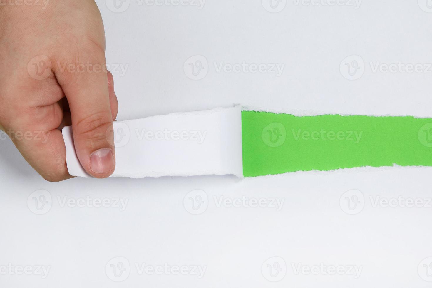 Hand tear a strip of paper photo