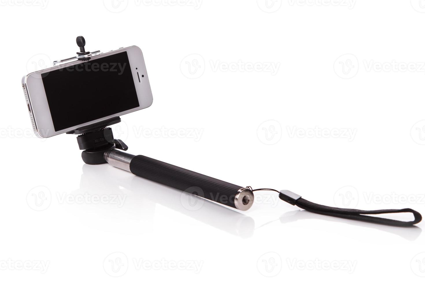 Smart phone on a selfie stick photo