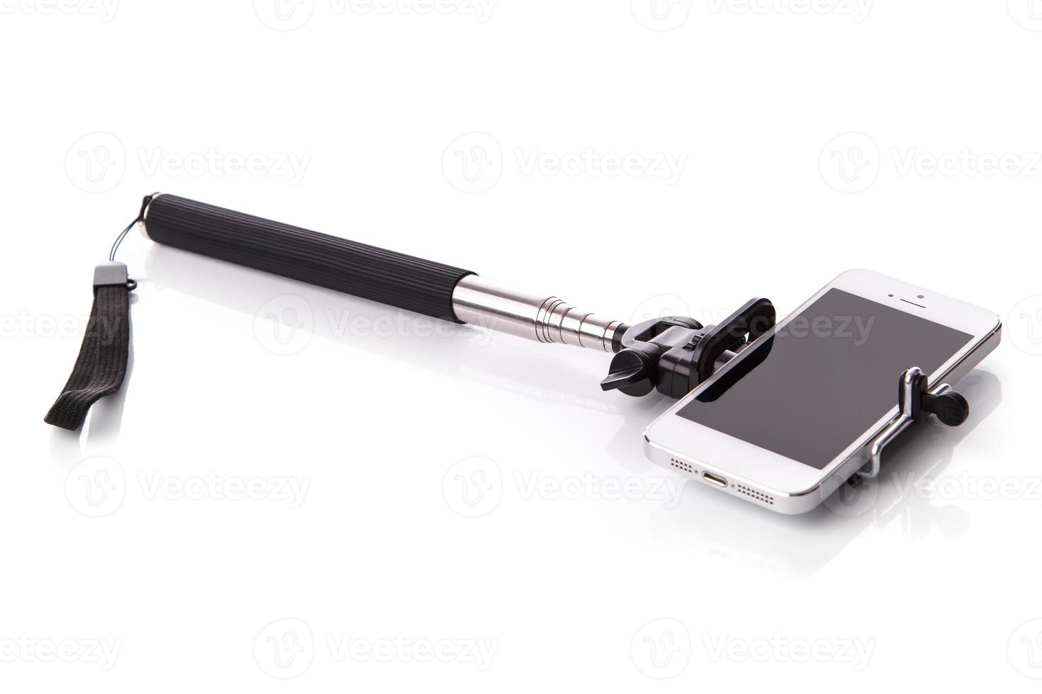 Smart phone on a selfie stick photo