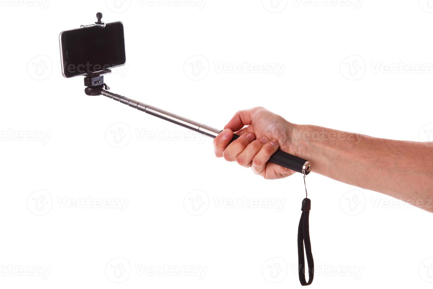 Smart phone on a selfie stick photo
