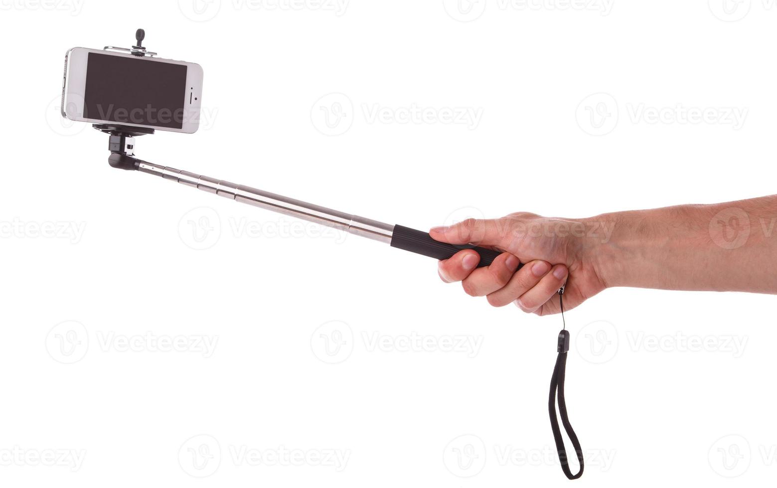 Smart phone on a selfie stick photo