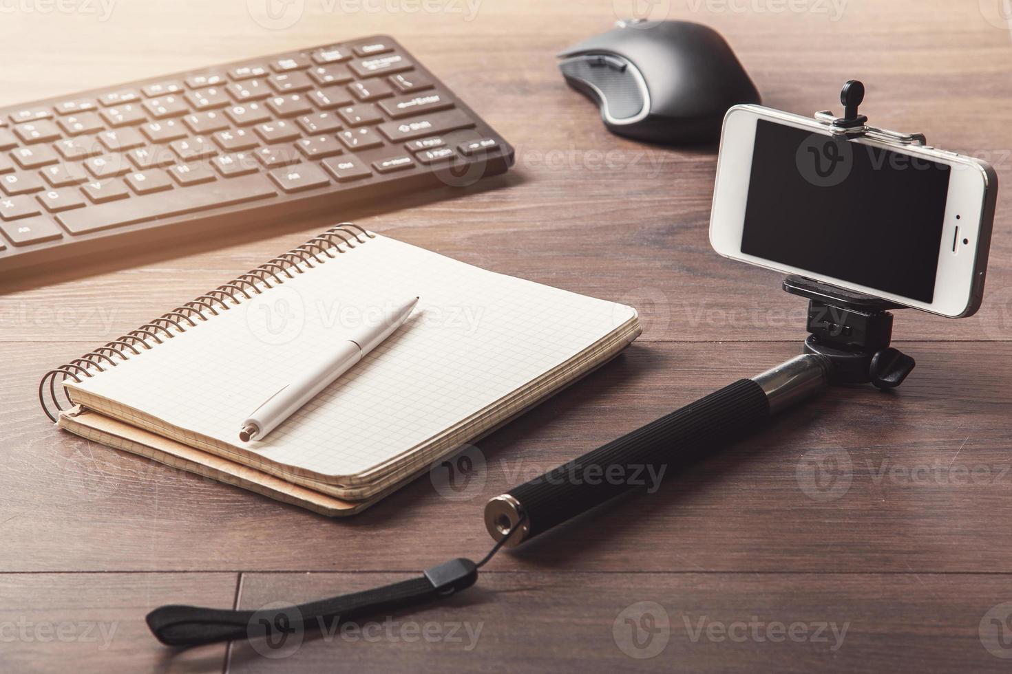 Blogger workplace with phone device photo