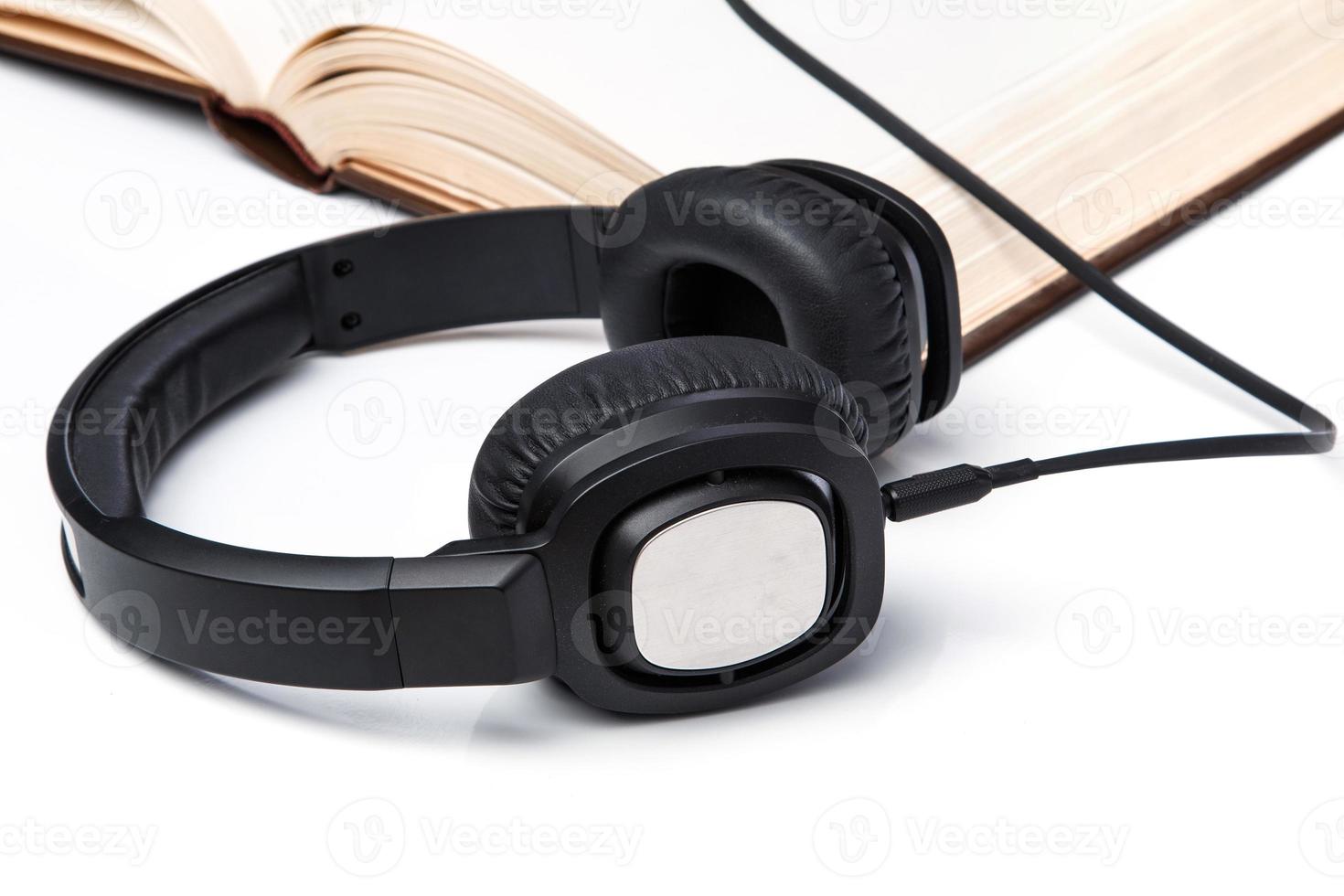 Audiobooks concept with books and headphone photo