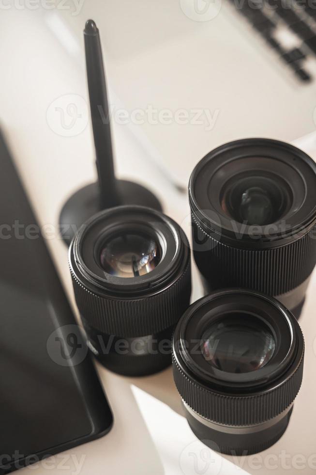Photographer's workplace with a different prime lenses photo