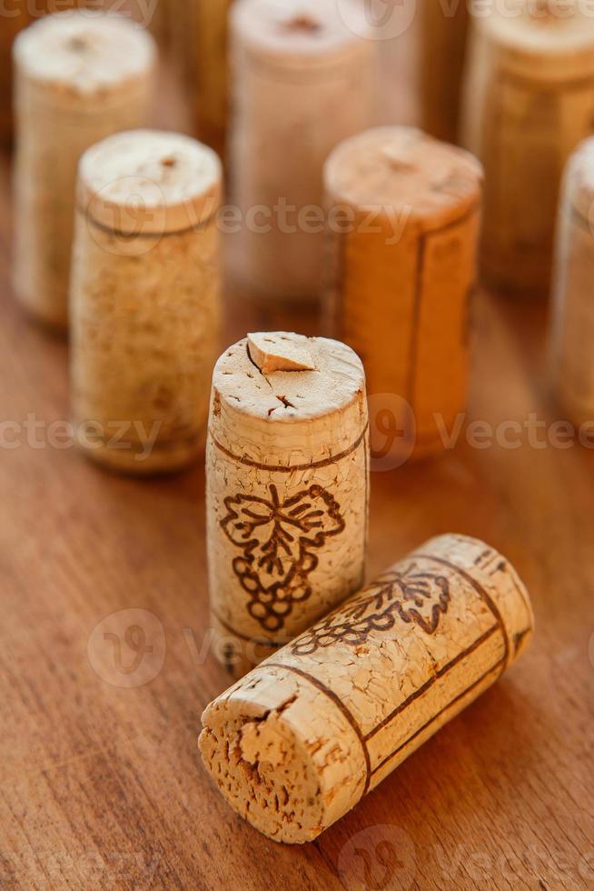 Wine corks on wooden background photo