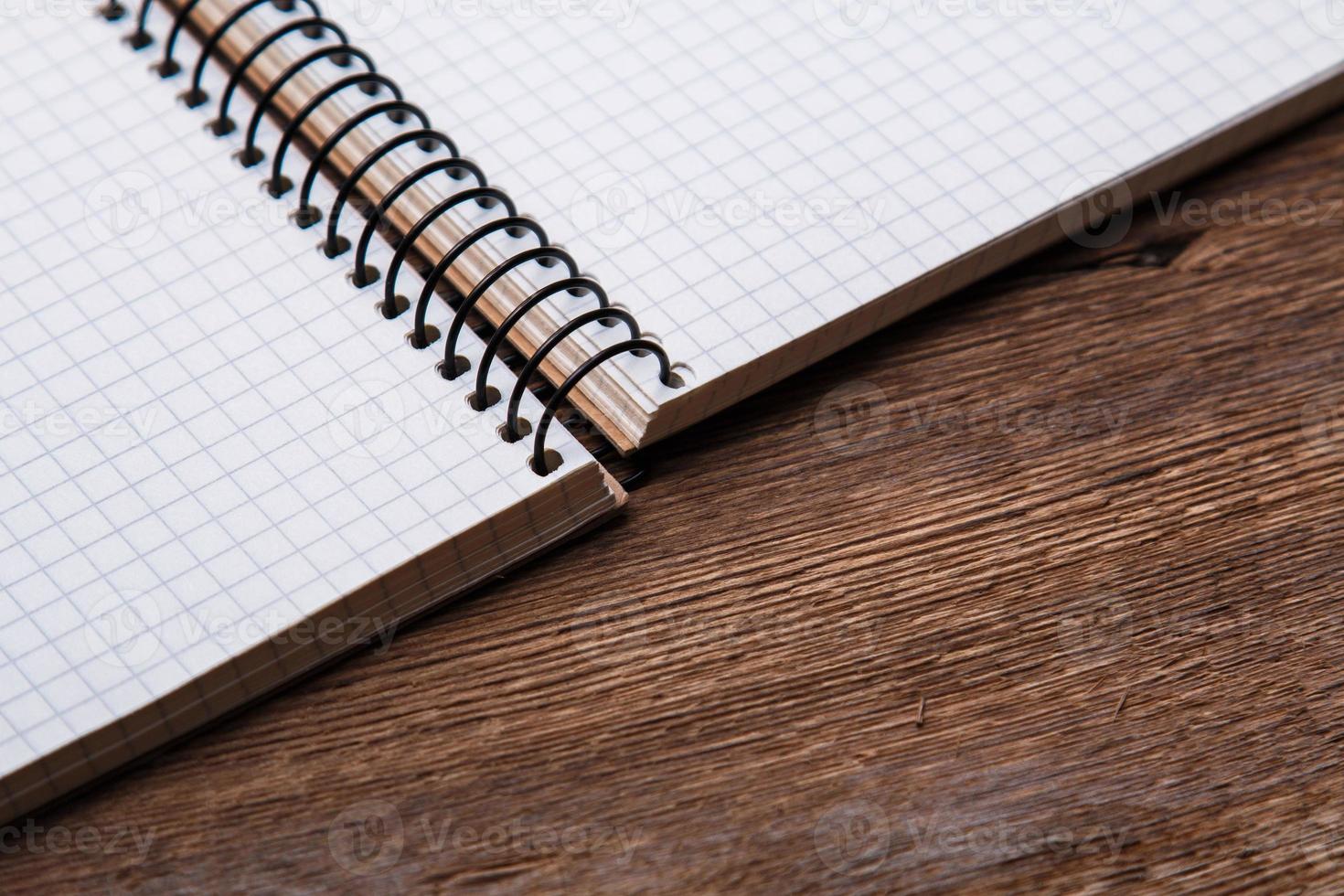 Notepad on wooden surface photo