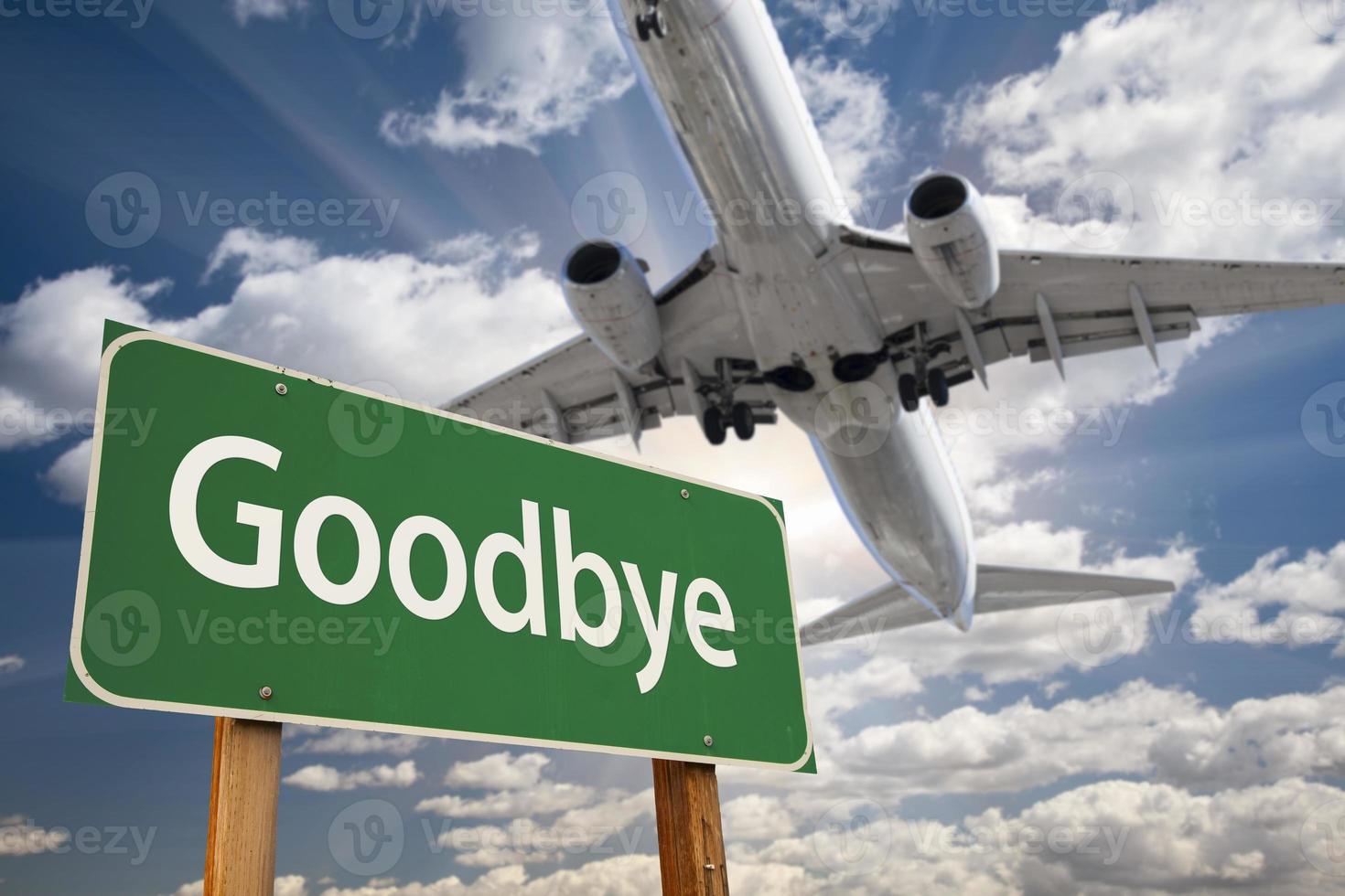 Goodbye Green Road Sign and Airplane Above photo