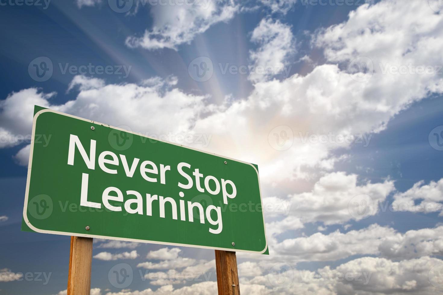 Never Stop Learning Green Road Sign photo