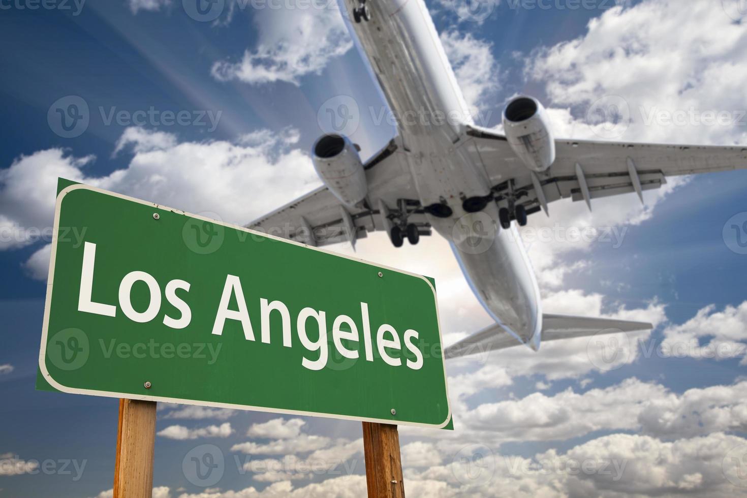 Los Angeles Green Road Sign and Airplane Above photo