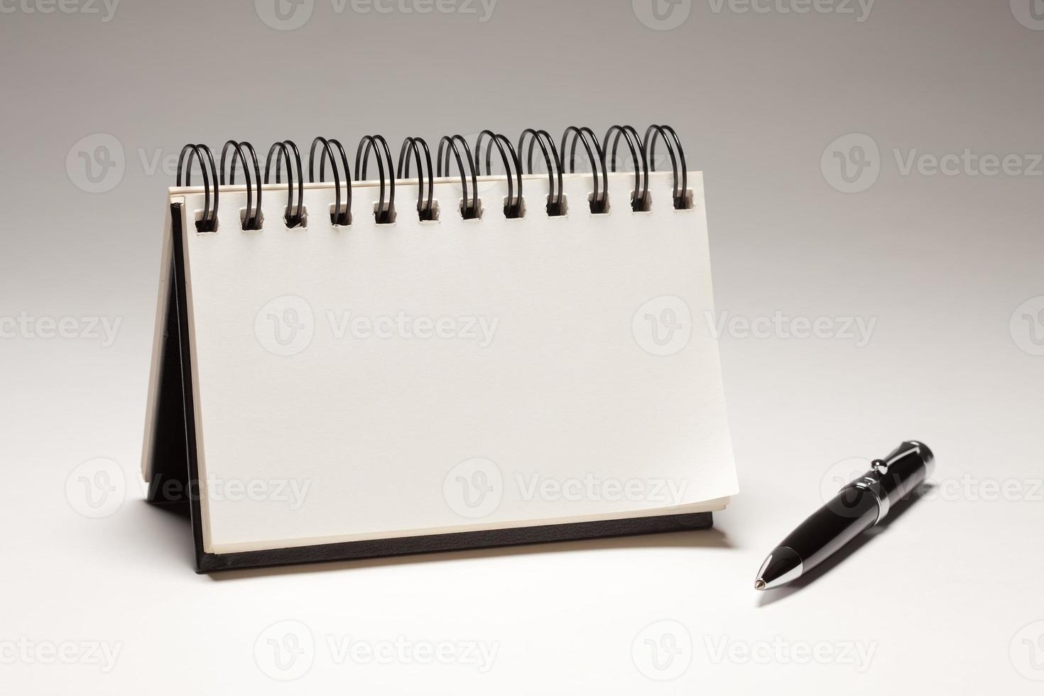 Blank Spiral Note Pad and Pen photo