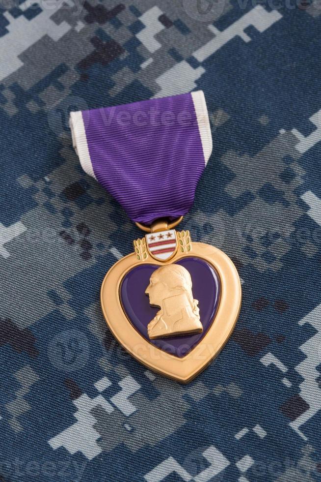 Purple Heart War Medal on Navy Camouflage Material photo