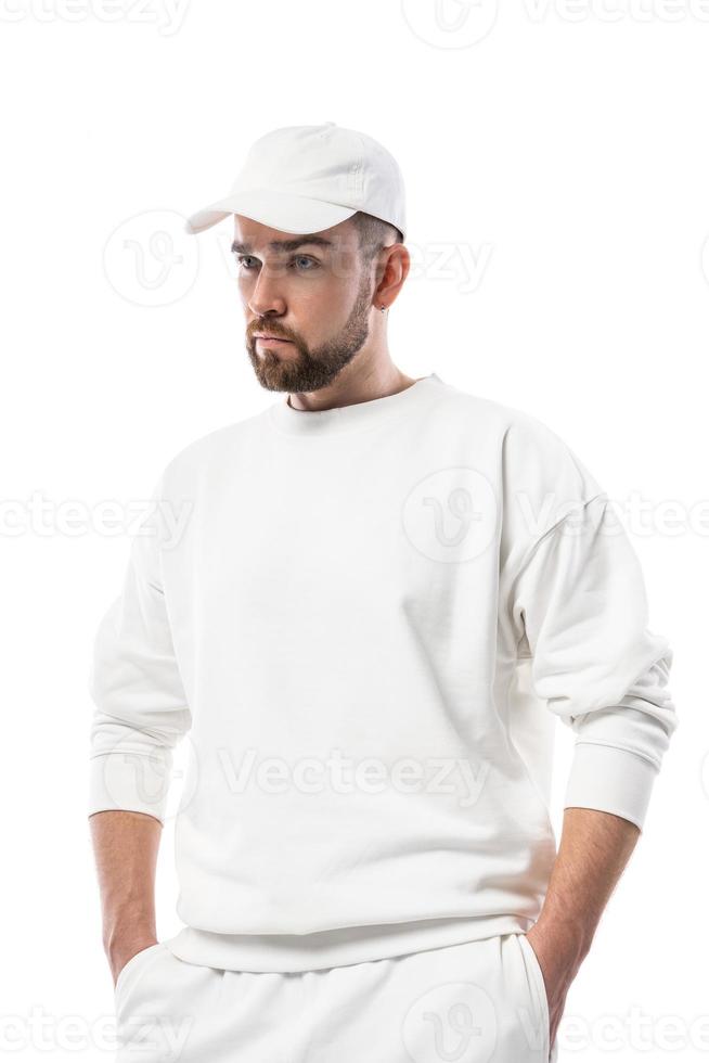 Handsome man wearing blank white cap on white background photo