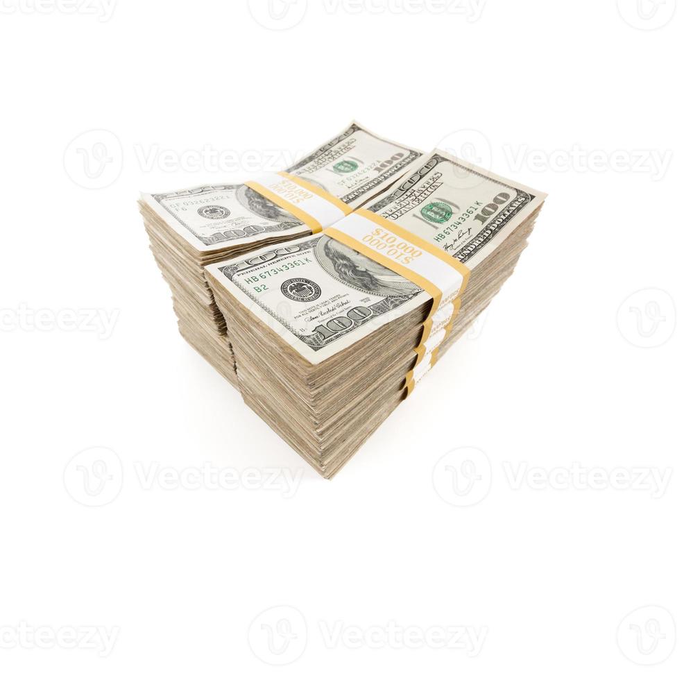 Stacks of One Hundred Dollar Bills Isolated on a White Background photo