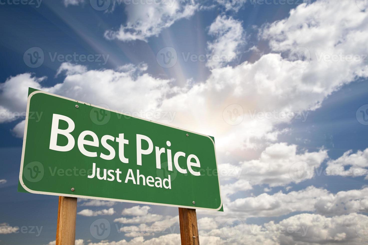 Best Price Green Road Sign Over Clouds photo