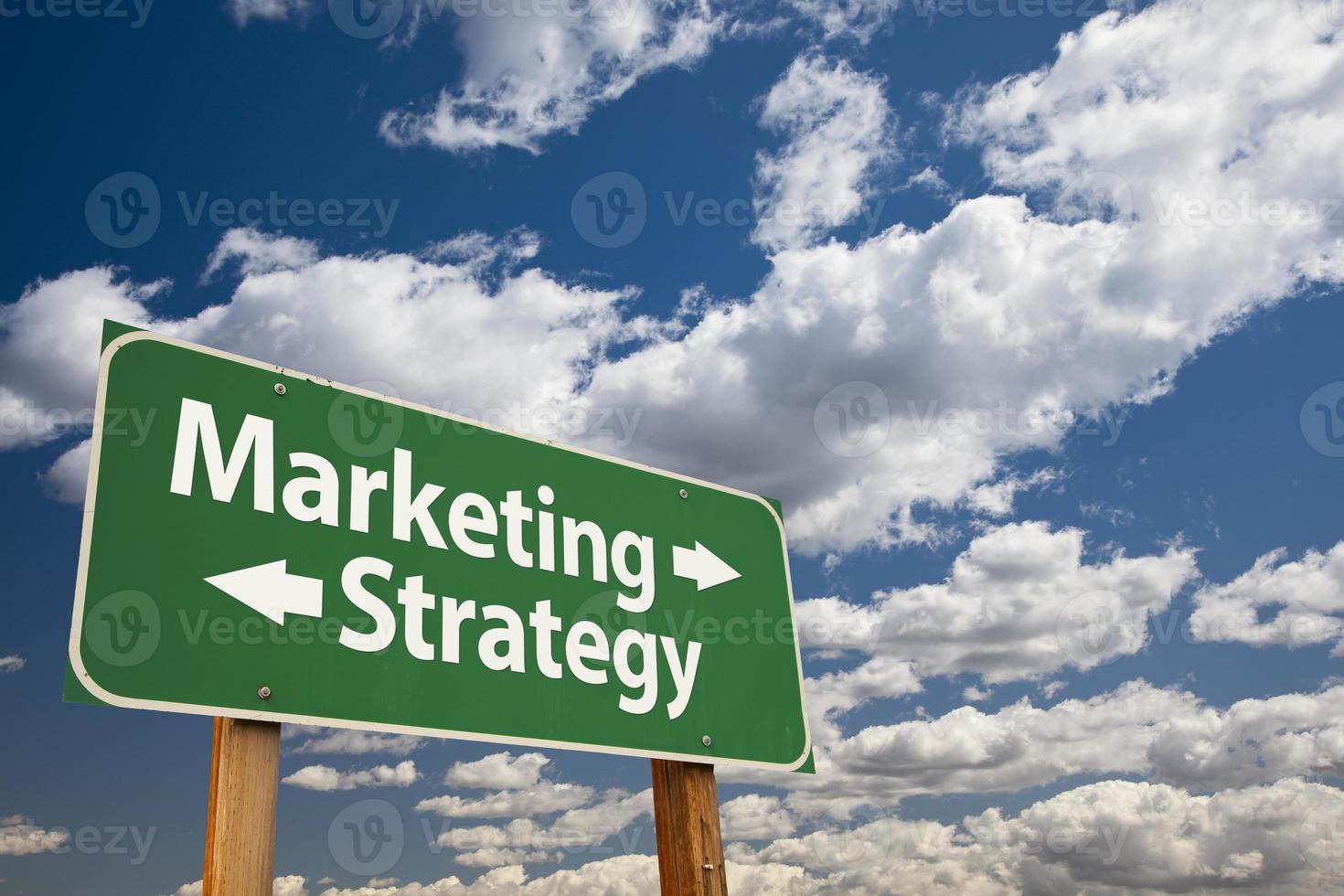 Marketing, Strategy Green Road Sign Over Clouds photo