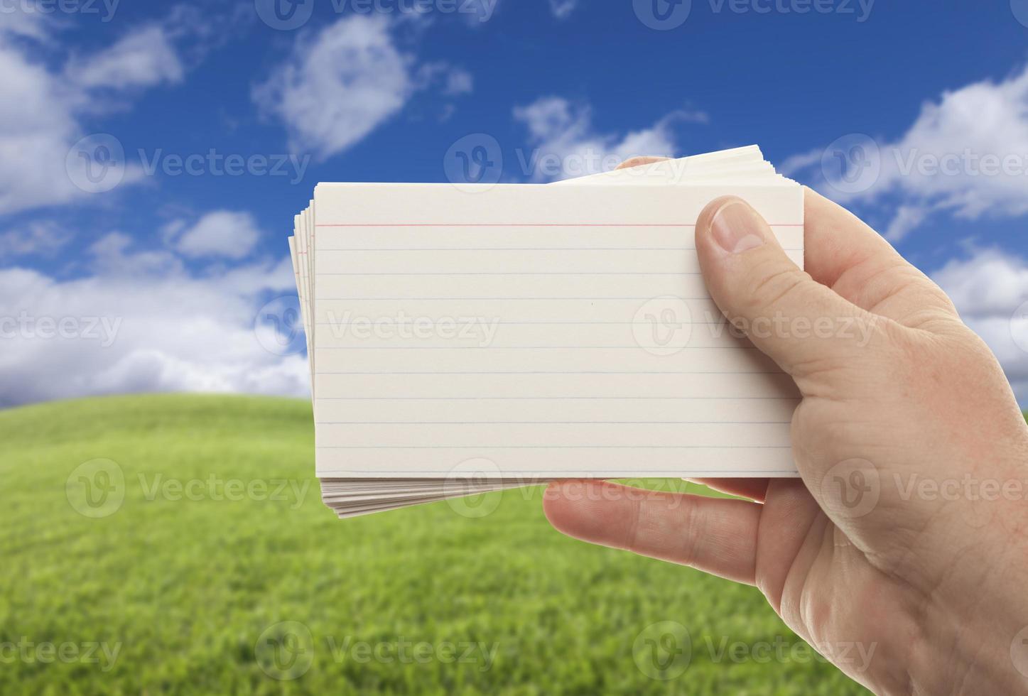 Male Hand Holding Stack of Flash Cards photo