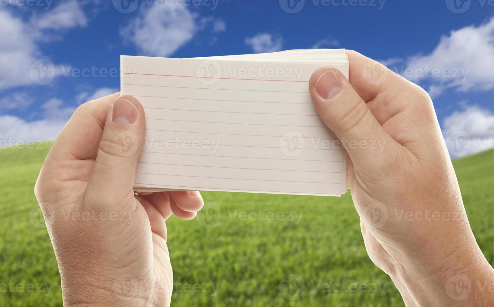 Male Hand Holding Stack of Flash Cards photo