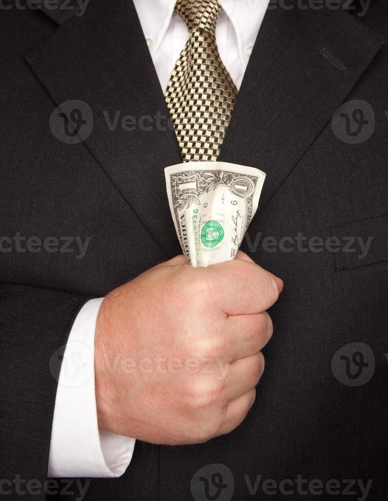 Businessman Squeezing Dollar Bill photo