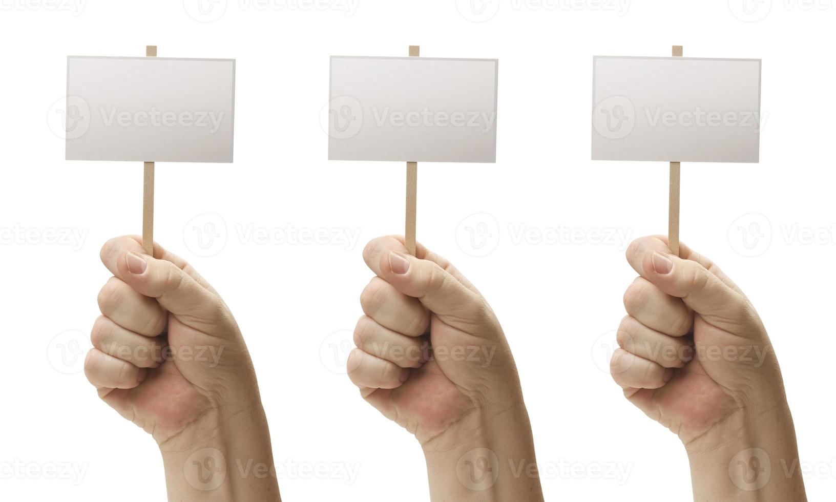 Three Blank Signs In Fist photo