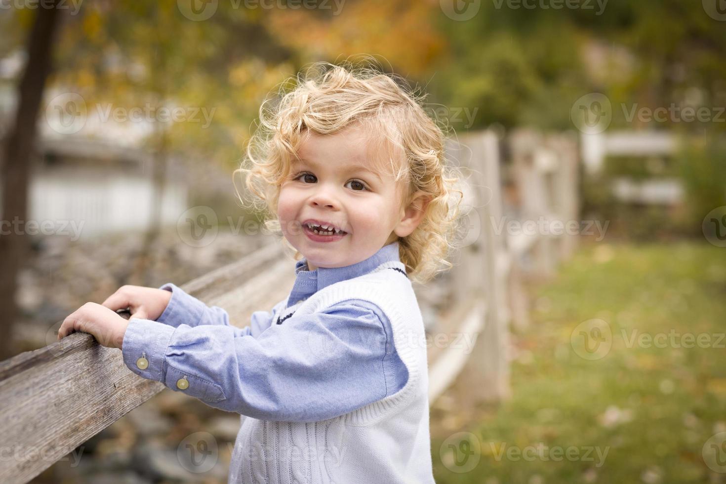 Adorable Young Boy Playing Outside photo