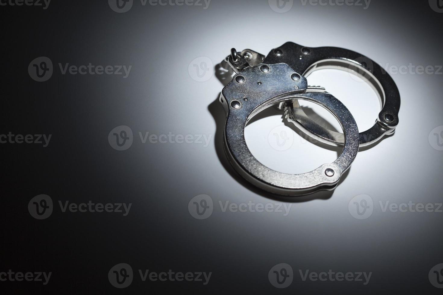 Abstract Pair of Handcuffs Under Spot Light - Text Room photo