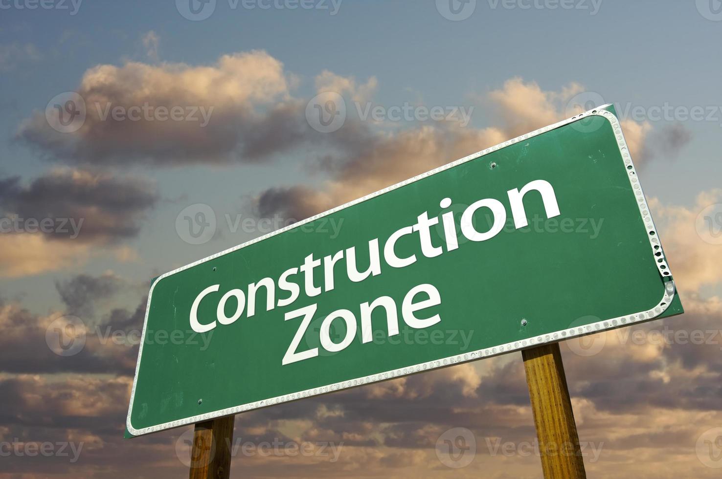 Construction Zone Green Road Sign and Clouds photo