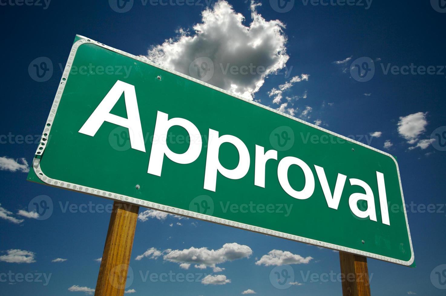 Approval Green Road Sign Over Clouds photo