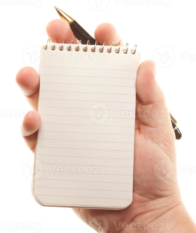 Male Hands Holding Pen and Pad of Paper photo