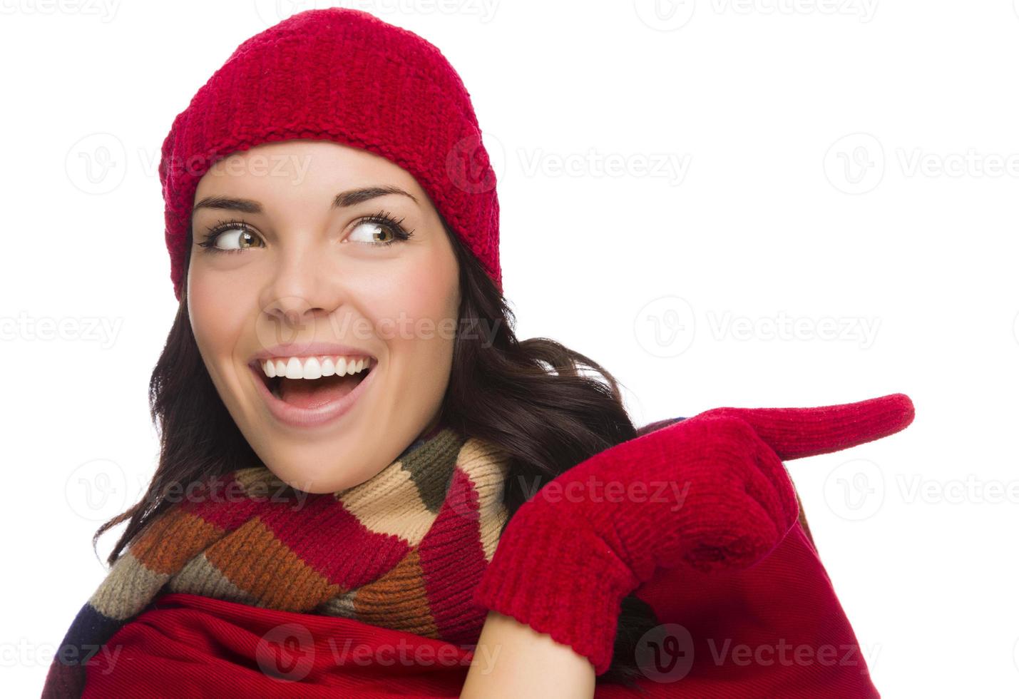 Mixed Race Woman Wearing Mittens and Pointing to the Side photo