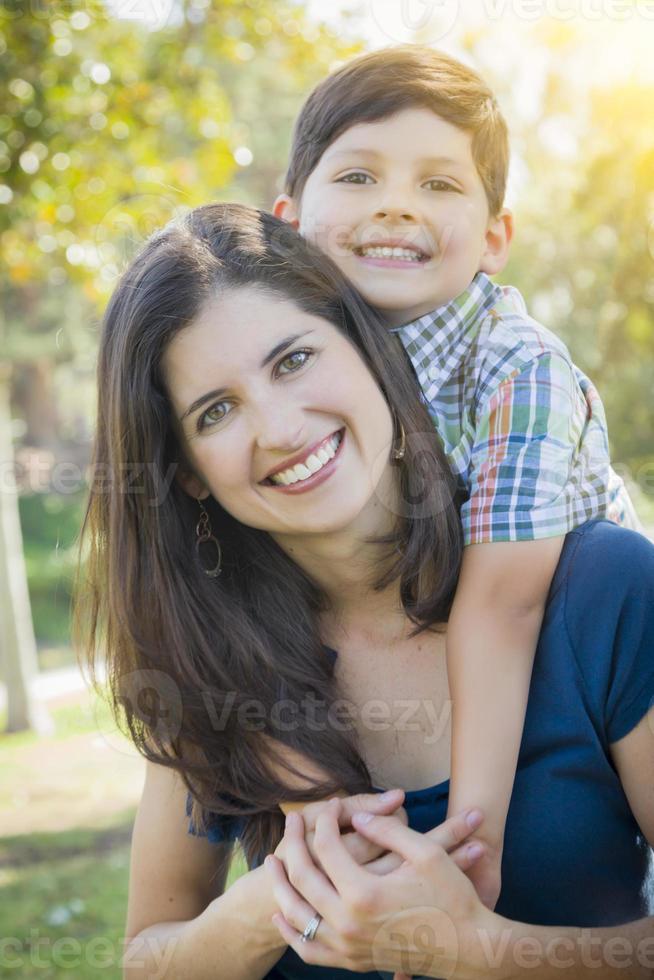 Attractive Mixed Race Mother and Son Hug in Park photo