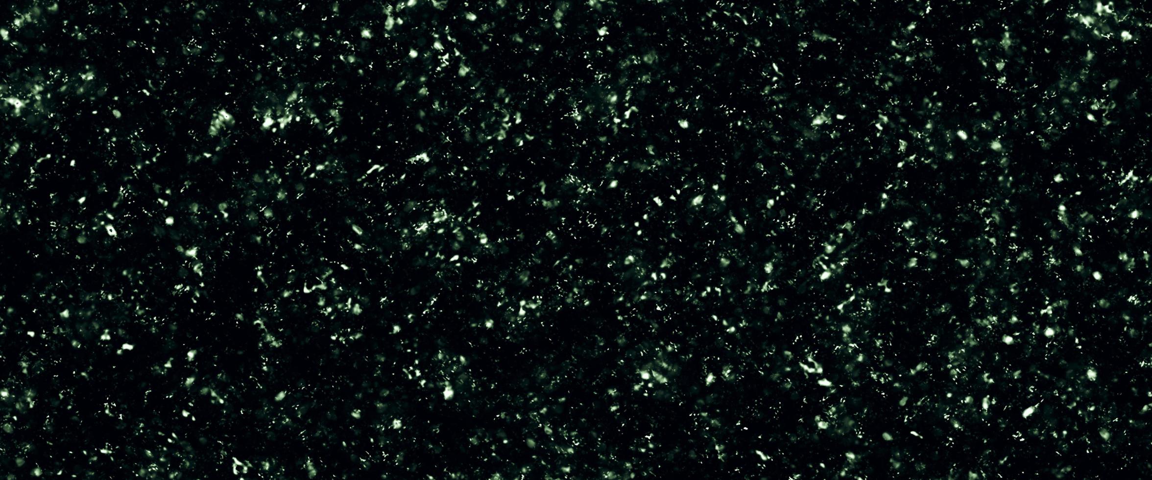 Colorful background blurry snow. Bokeh background with snowflake. Winter glittering snowflakes swirl bokeh background, backdrop with sparkling blue stars. Snowflake winter season. photo