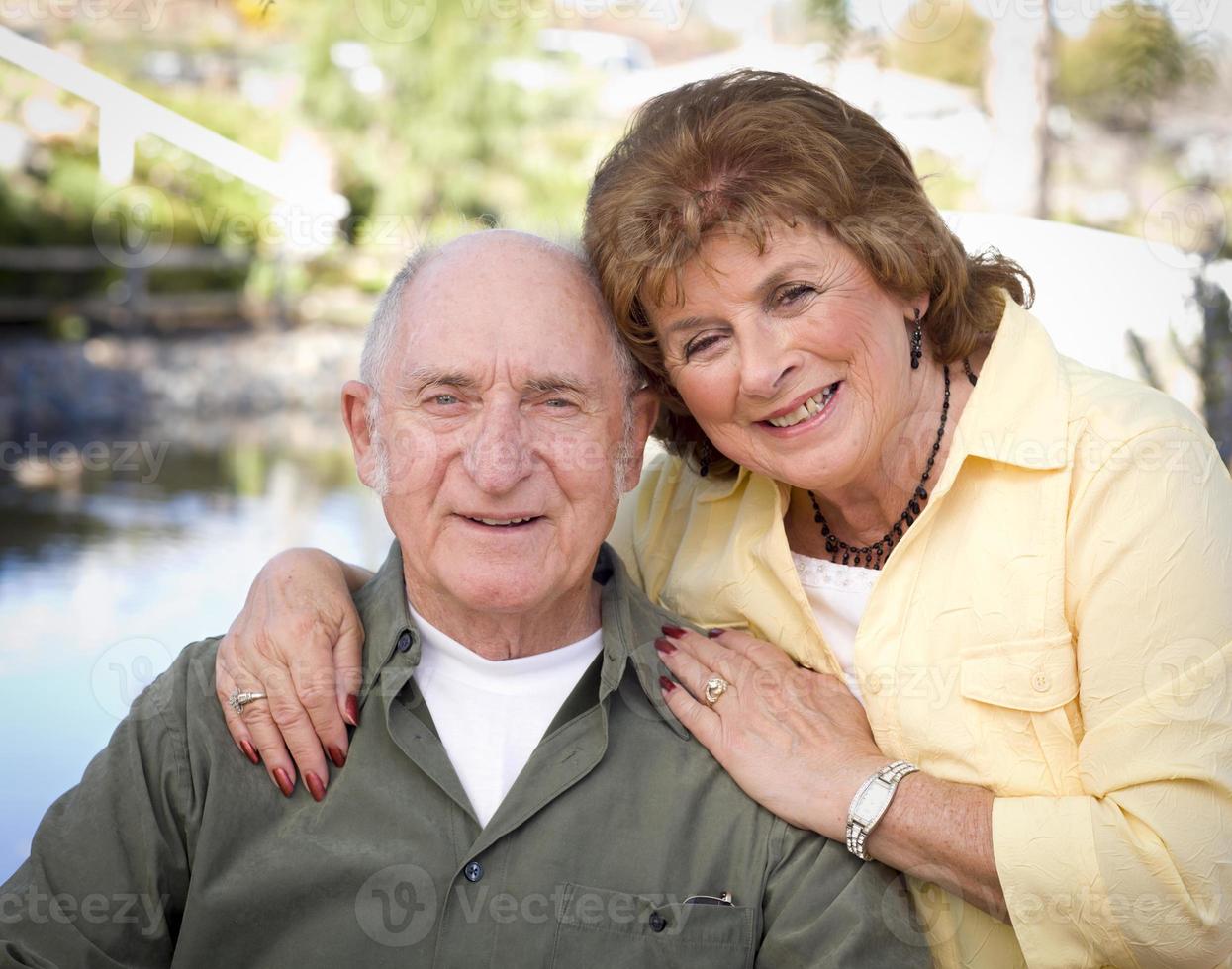 Happy Senior Couple Relaxing in The Park photo