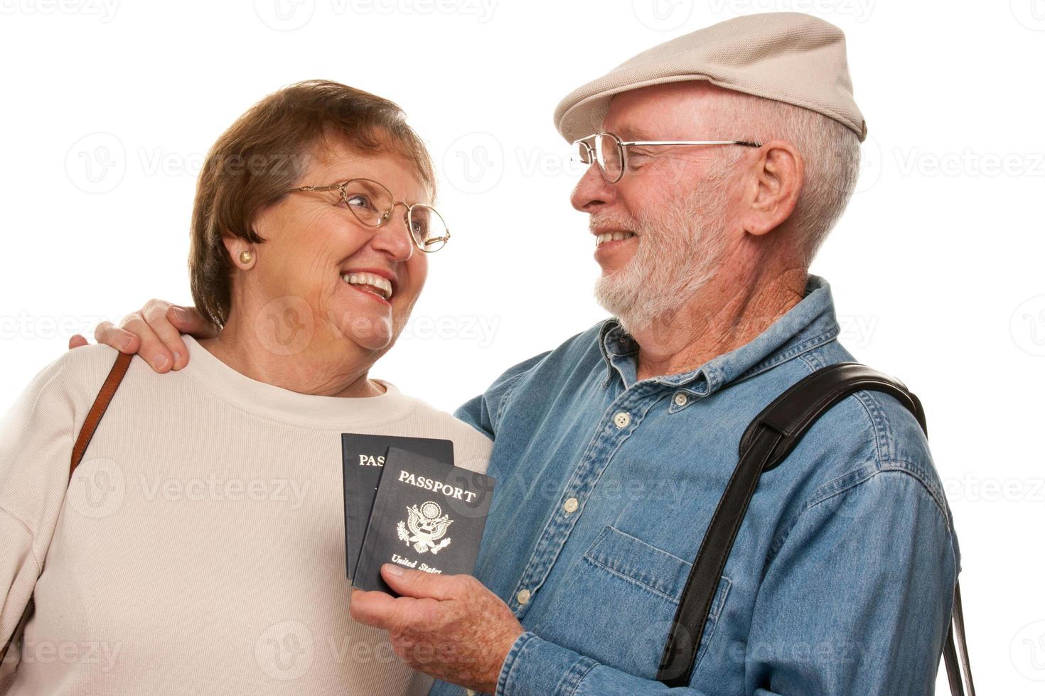 Happy Senior Couple with Passports and Bags on White photo