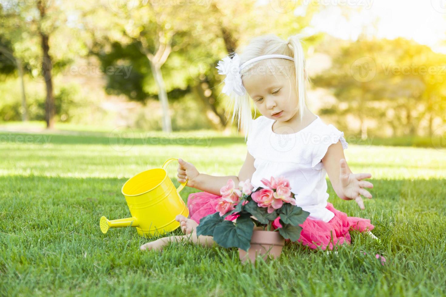 Cute Little Girl Playing Gardener with Her Tools and Flower Pot. photo