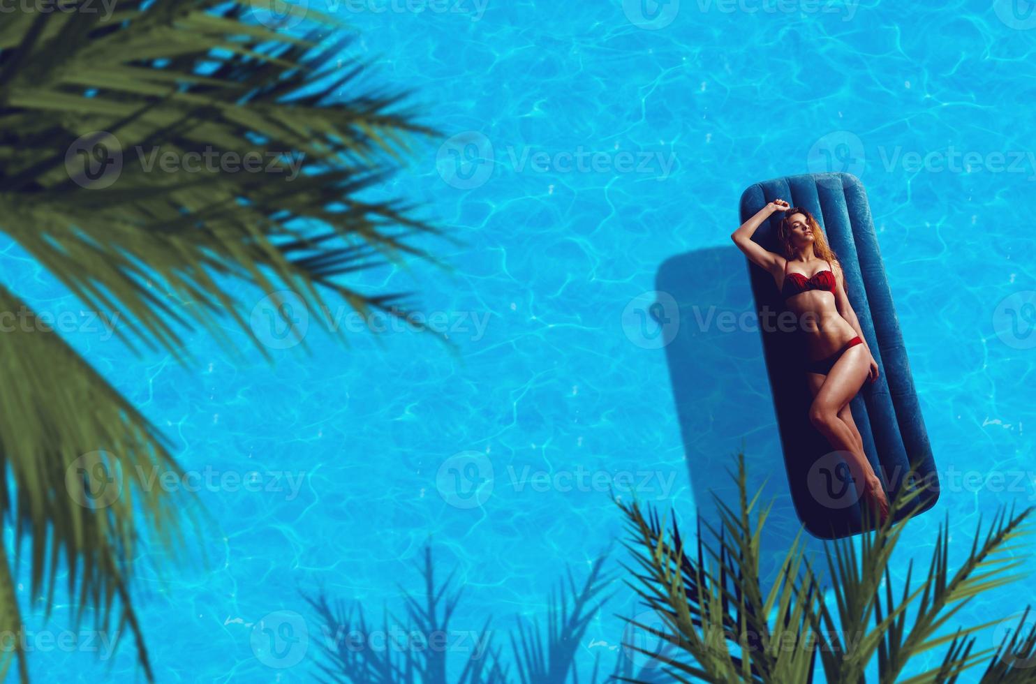 lady in red bikini lying on the sun photo