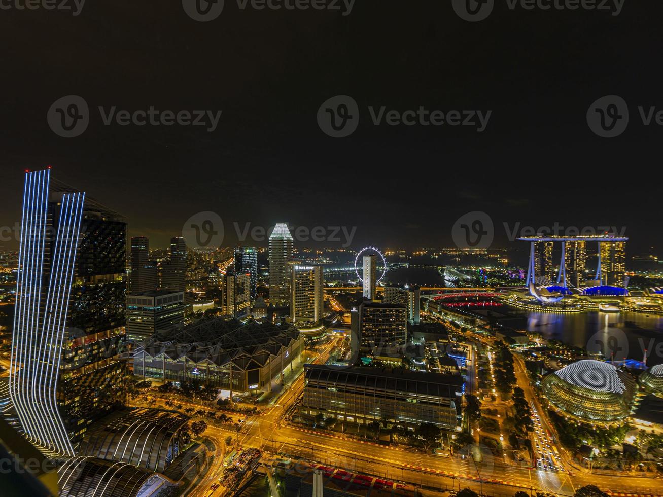 Aerial panoramic picture of Singapore skyline and gardens by the bay during preparation for Formula 1 race in the night in autumn photo