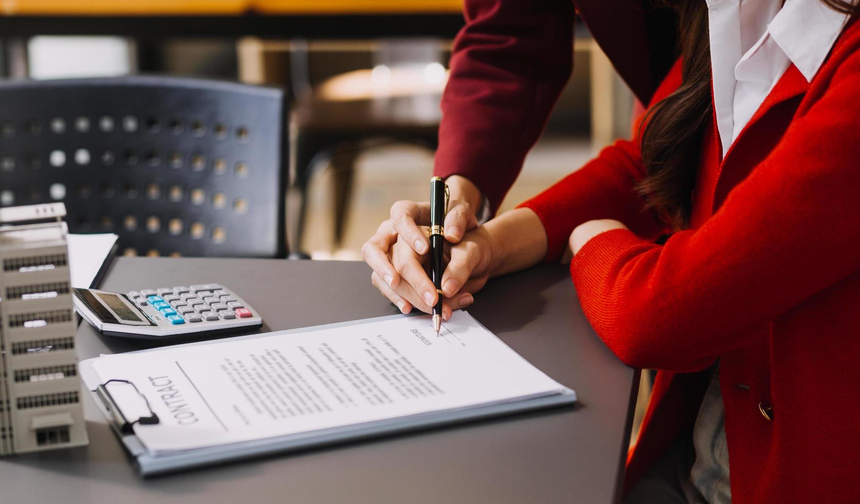 Discussion with a real estate agent, House model with agent and customer discussing for the contract to buy, get insurance or loan real estate or property. photo