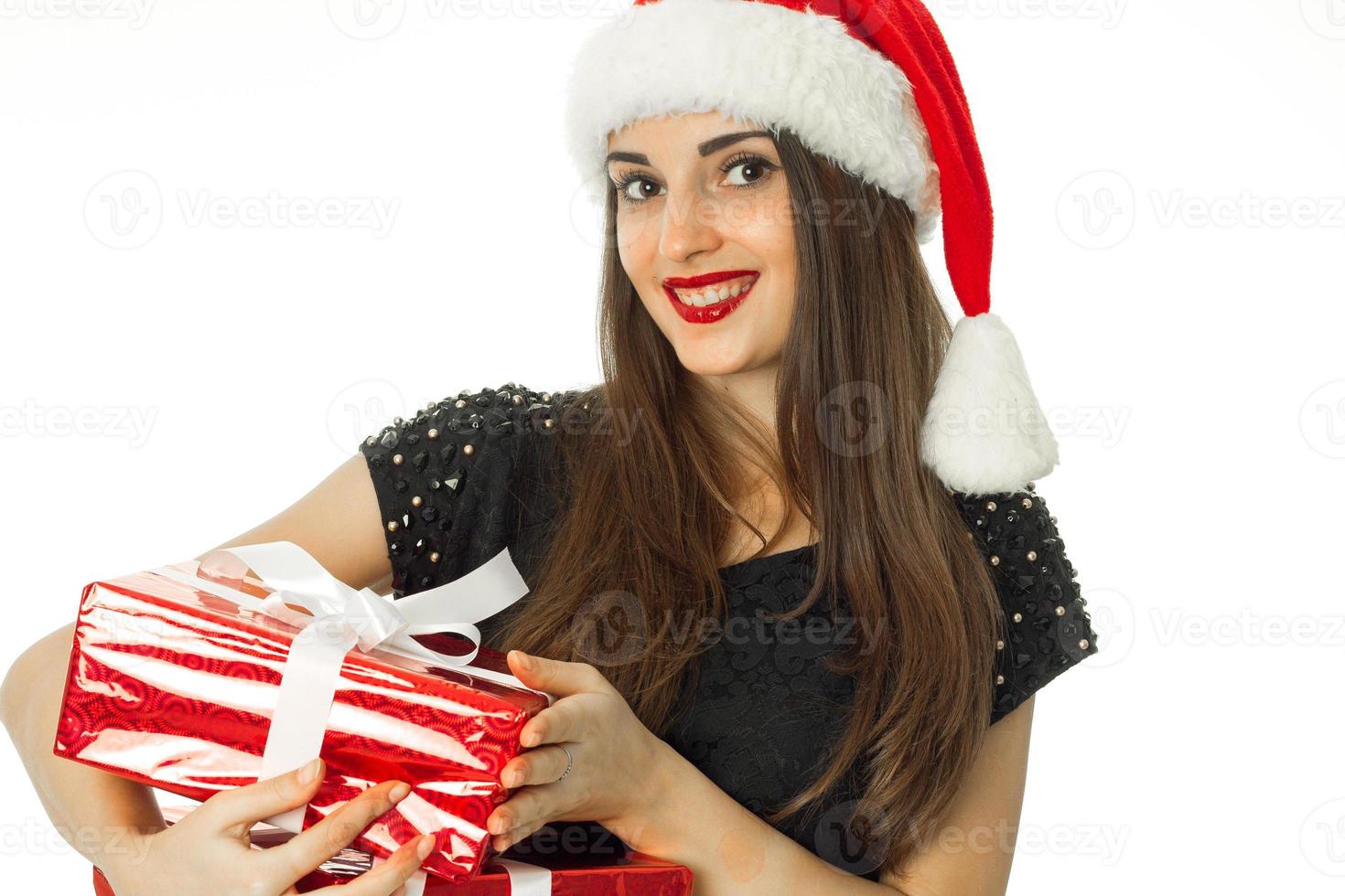 adorable brunette woman in santa hat photo